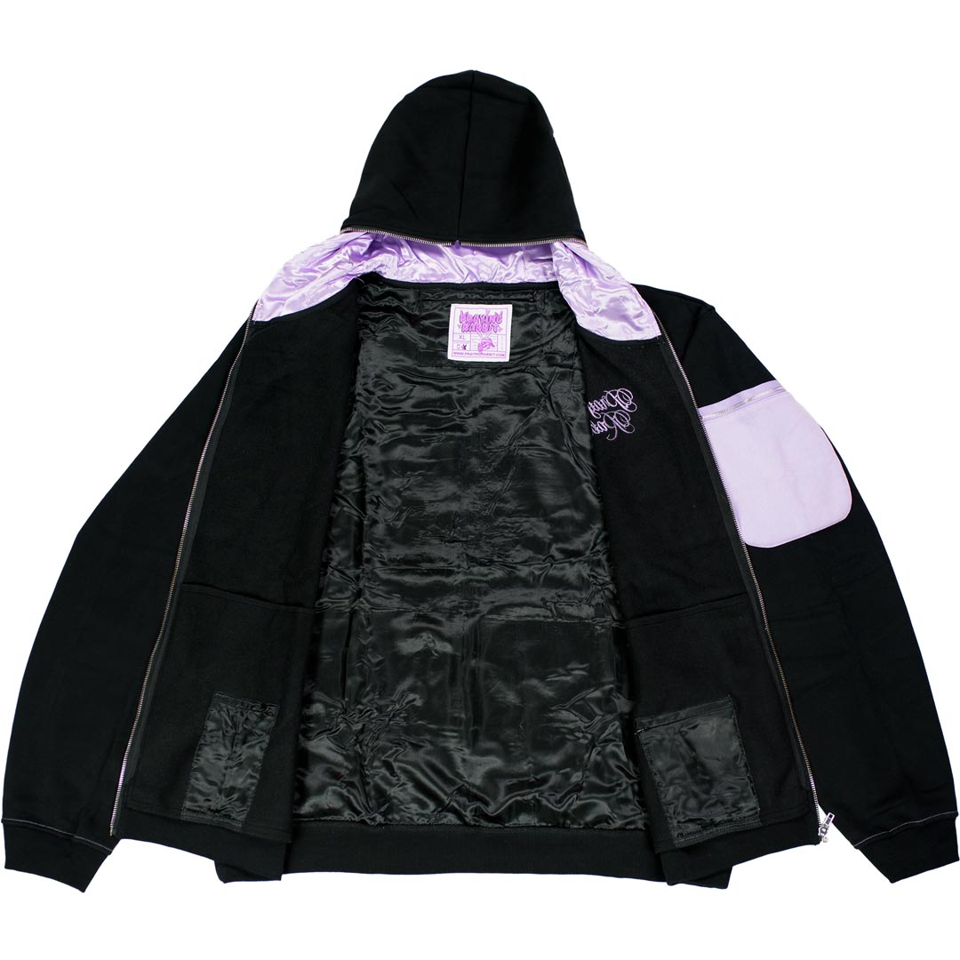 black hoodie with satin-lined hood and interior. it shows hidden zipper pockets on the inside.