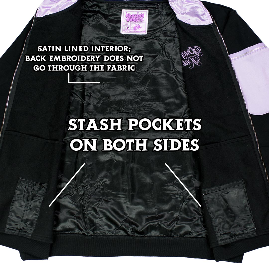 close up of the inside of the hoodie which shows the satin-lined interior and hidden stash pockets on both sides
