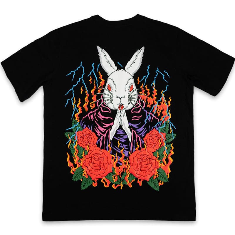 black shirt with a jumbo screen printed praying rabbit design. there are 4 red roses around the rabbit along with fire and thunder.