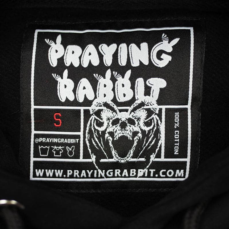 praying rabbit woven label with the demon rabbit bat skeleton