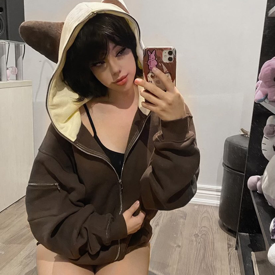 female model wearing cream and brown bunny ear hoodie