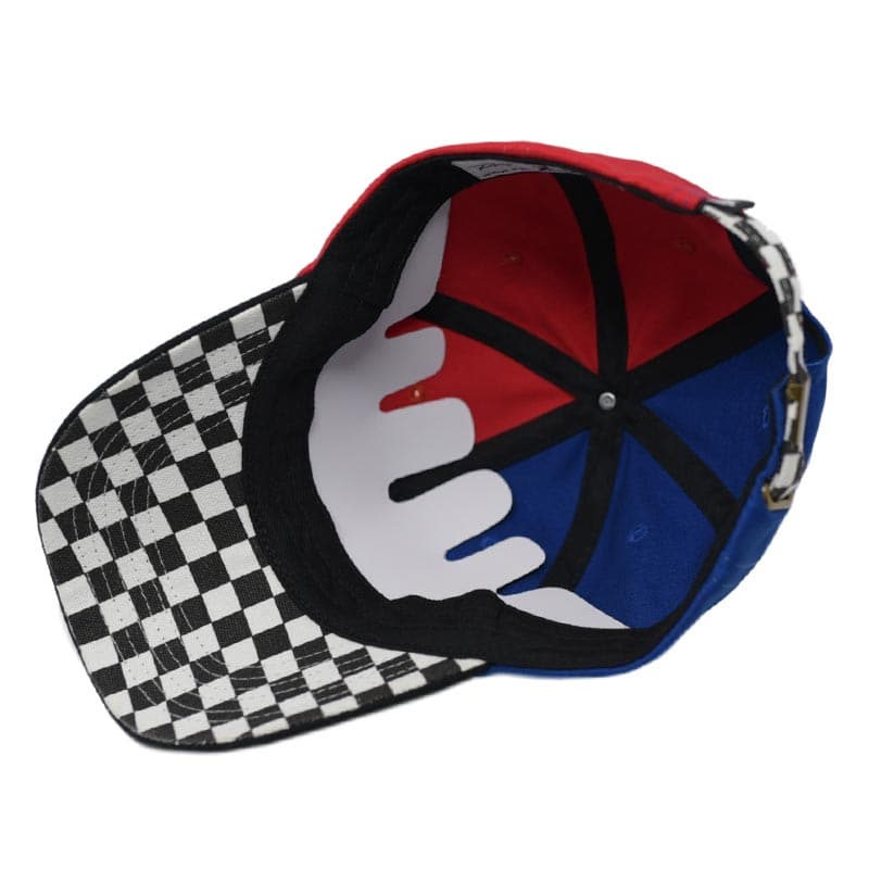 bottom view of red and blue color block hat with a checkerboard under visor