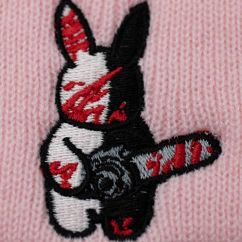 close up of embroidery design that shows bloody rabbit holding a chainsaw