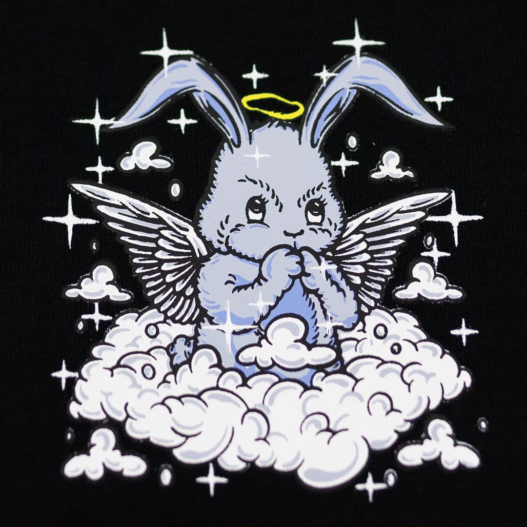 close up of praying rabbit angel on a cloud. the rabbit is praying