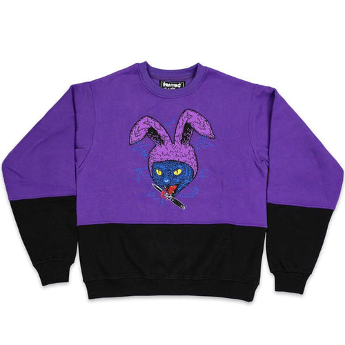 half black and purple crew neck with an embroidered cat with bunny ears, holding a tongue in its mouth design