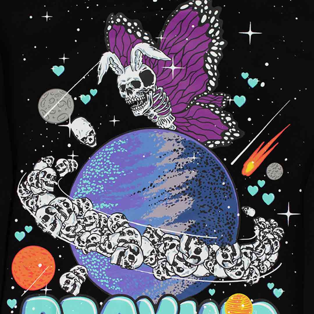 rabbit skeleton butterfly with purple wings hovering over the planet saturn. there are many skulls flying around the planet as rings. there are hearts, sparkles, comets, and planets surrounding the design