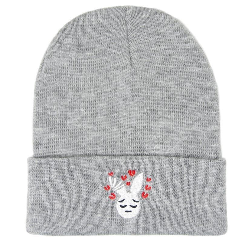 white sad rabbit with broken red hearts embroidered on a grey beanie