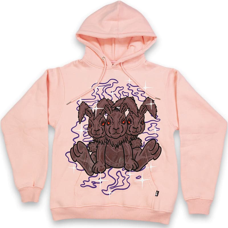 pink graphic hoodie with three headed rabbit printed over the pocket