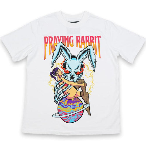 white t-shirt with a screen printed graphic design that shows a blue rabbit holding a girl sitting on top of saturn planet