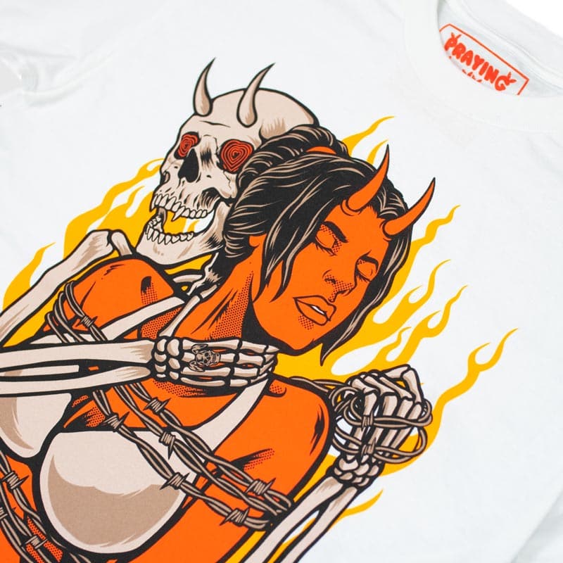 close up view of design that shows demon skeleton holding demon girl