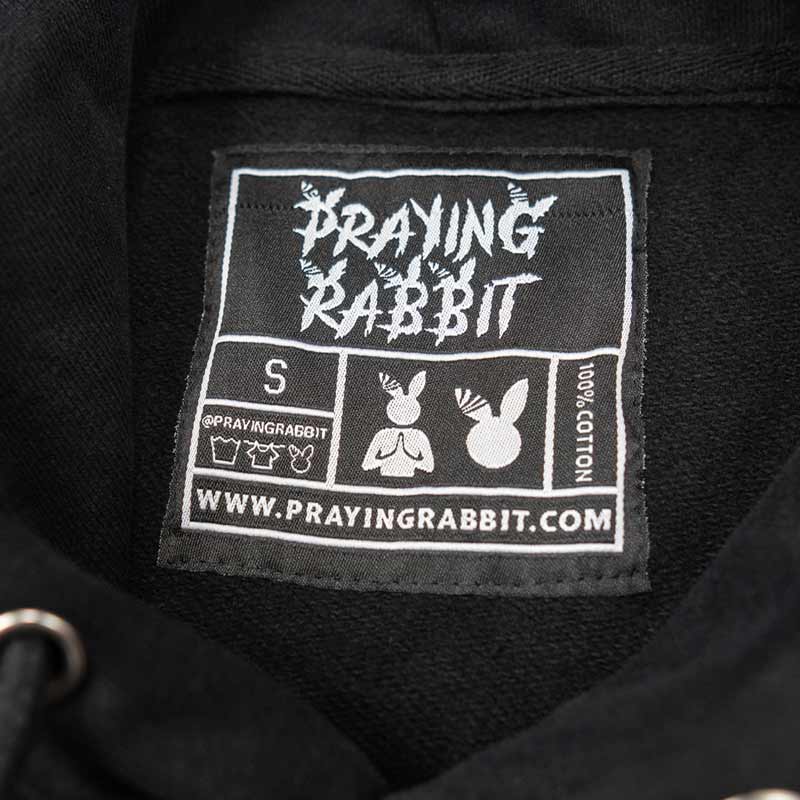 inside woven label for the black hoodies. it reads 100% cotton with our logo on it.