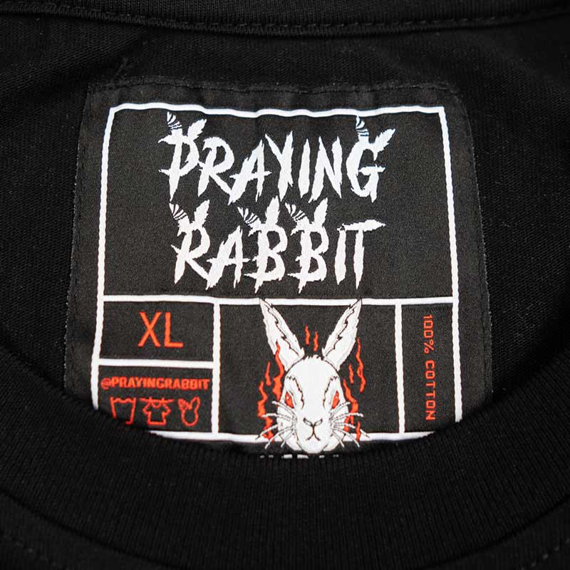 inside woven label that reads praying rabbit.