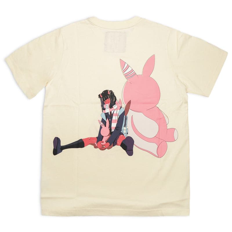 demon school girl sitting against a giant pink plush rabbit screen printed on the back of a cream shirt