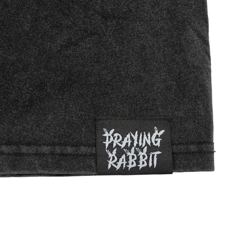praying rabbit woven label on bottom of shirt