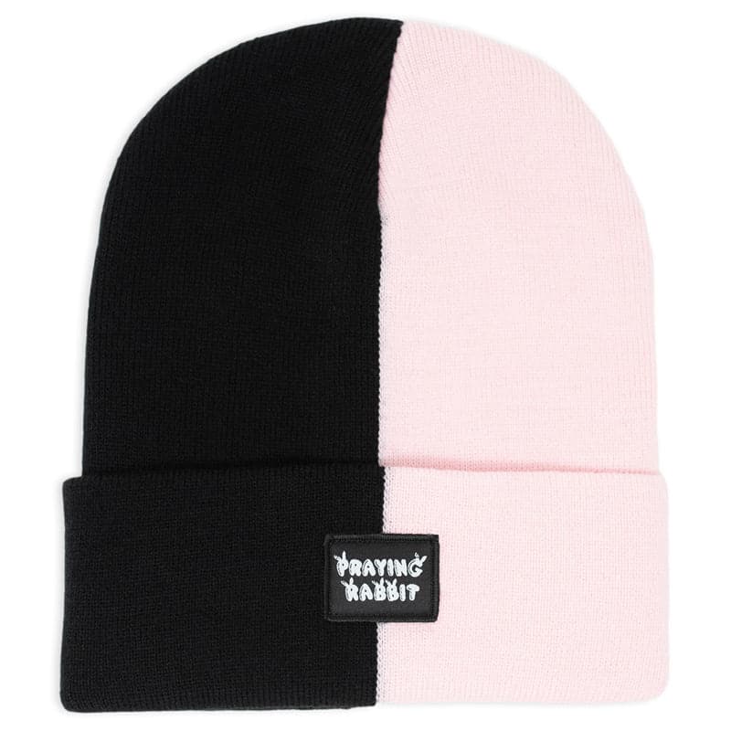 Half black and half pink split beanie with a small praying rabbit woven label on the cuff