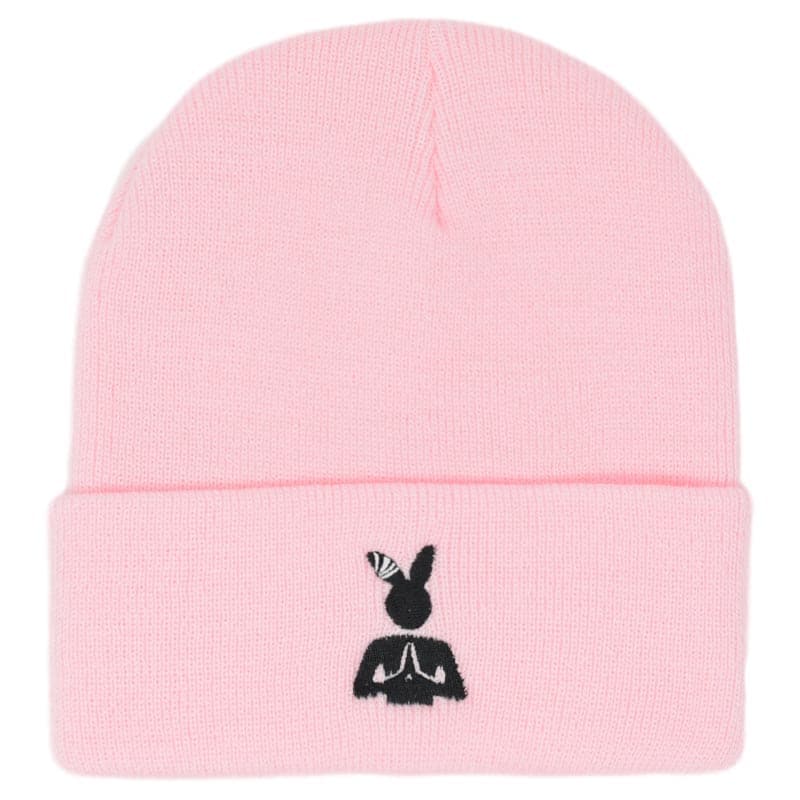 pink beanie with an embroidered black praying rabbit design
