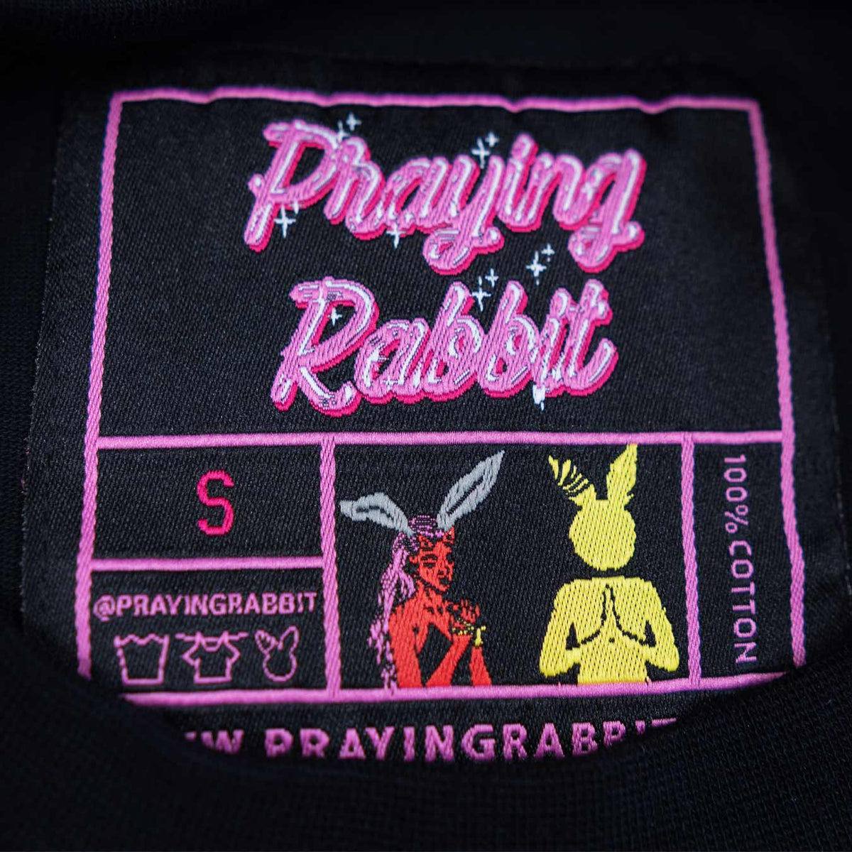 inside woven label that matches the prayboy design.