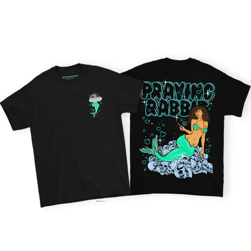 black t-shirt with a front and back design. the front has a mermaid printed on the left chest. and on the back is the same mermaid sitting on top of skulls blowing heart shaped bubbles