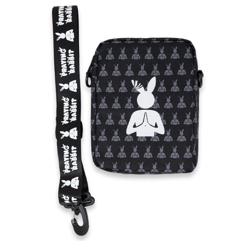 side bag with the praying rabbit adjustable strap next to it