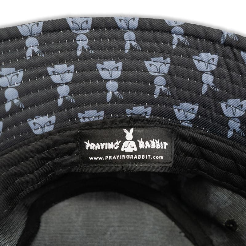 woven label inside the bucket hat that says praying rabbit