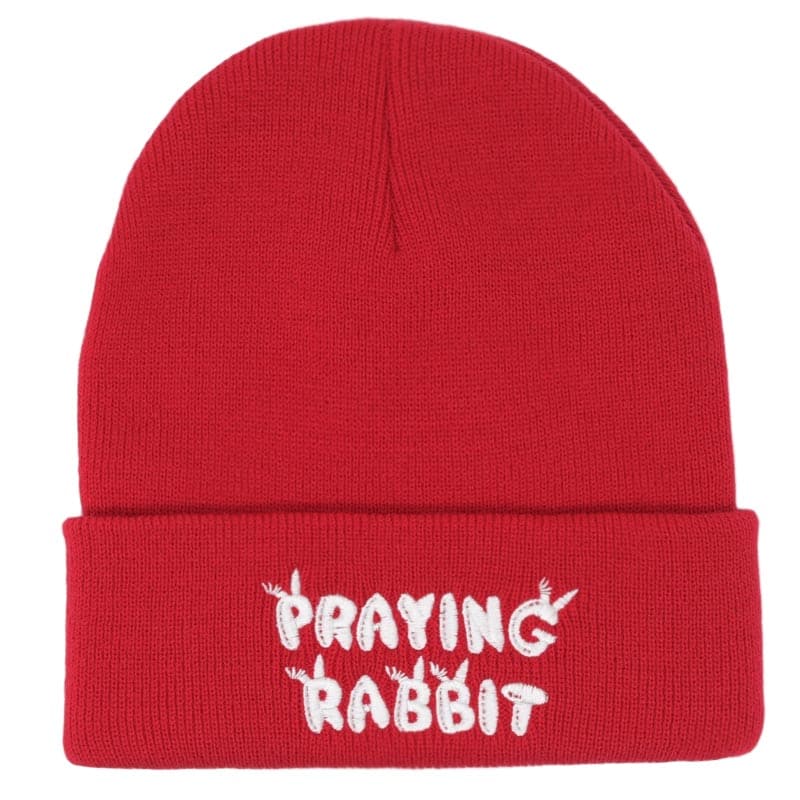 red beanie with white praying rabbit bubble letters embroidered