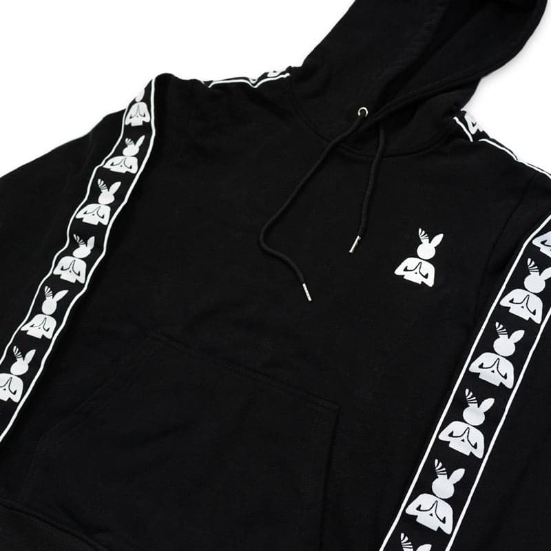 close up view of the black praying rabbit hoodie. pictured is the embroidered logo, drawstrings, and pattern on the sleeves.