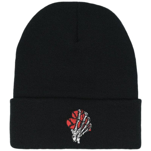 white skeleton hand holding a red broken heart beanie
