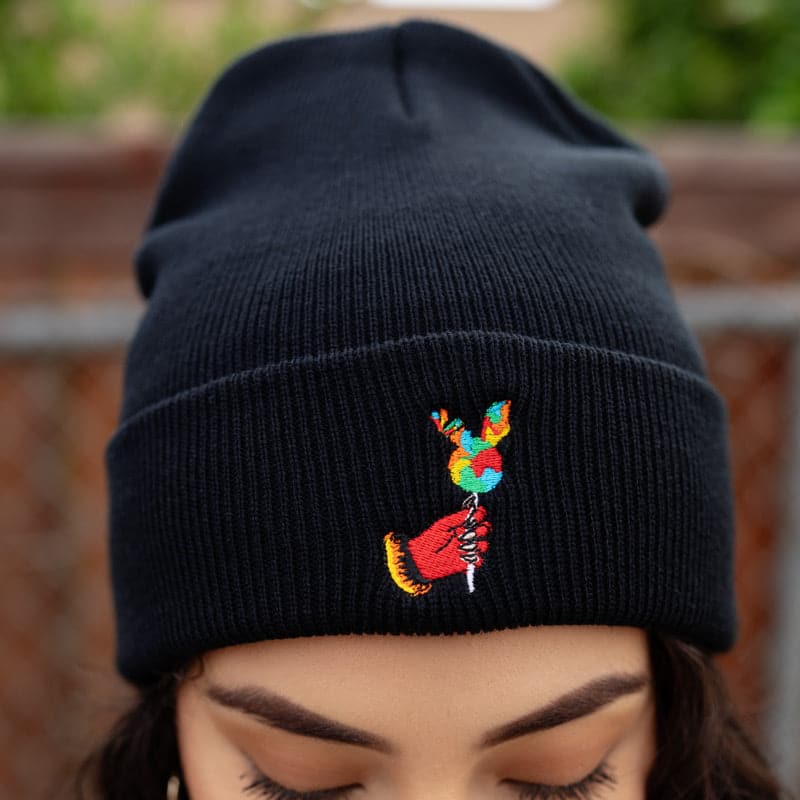 red demon hand holding a rabbit lollipop embroidered beanie
